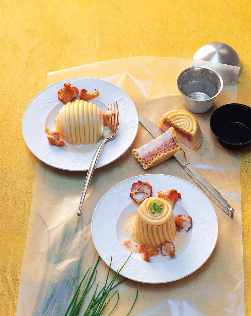 Macaroni timbales on plates