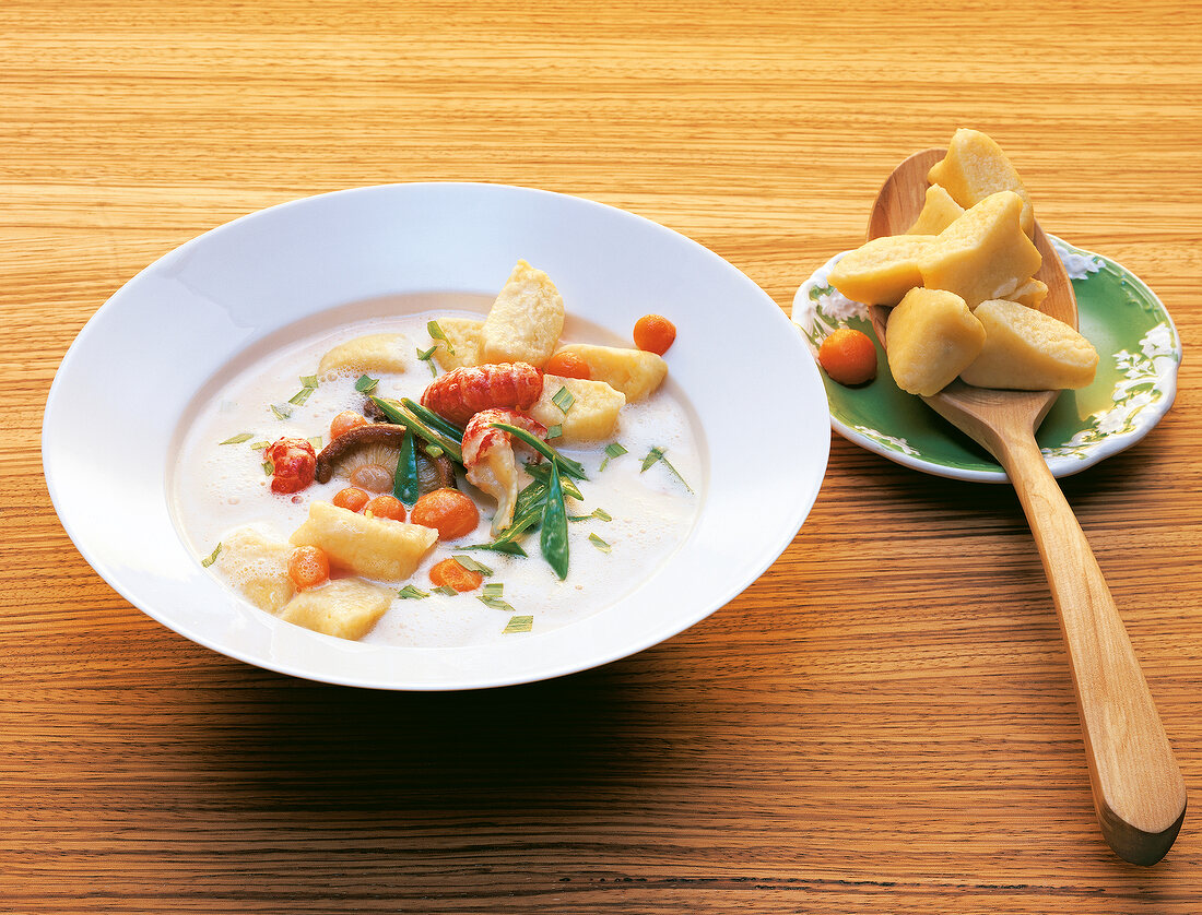 Gnocchi with morel mushrooms and crayfish on plate