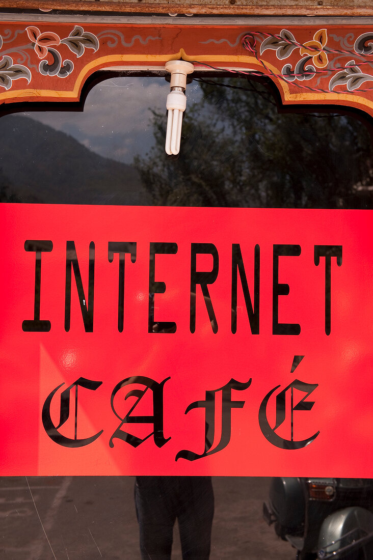 Close-up of internet cafe sign board at Bhutan