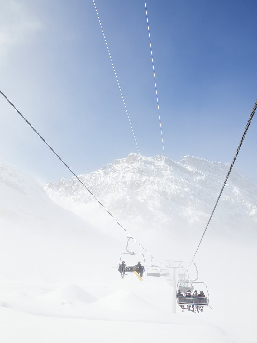 View of Titlis chair lift in fog at Uri Alps, Engelberg, Switzerland
