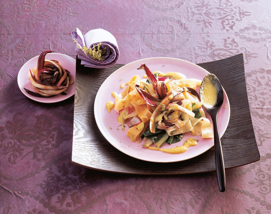 Pappardelle pasta with chard and radicchio trevisano on plate