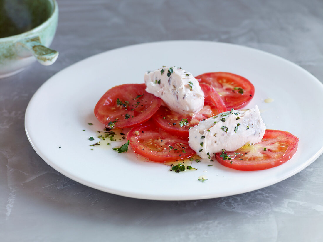 Tomatoes with tofu cream on plate