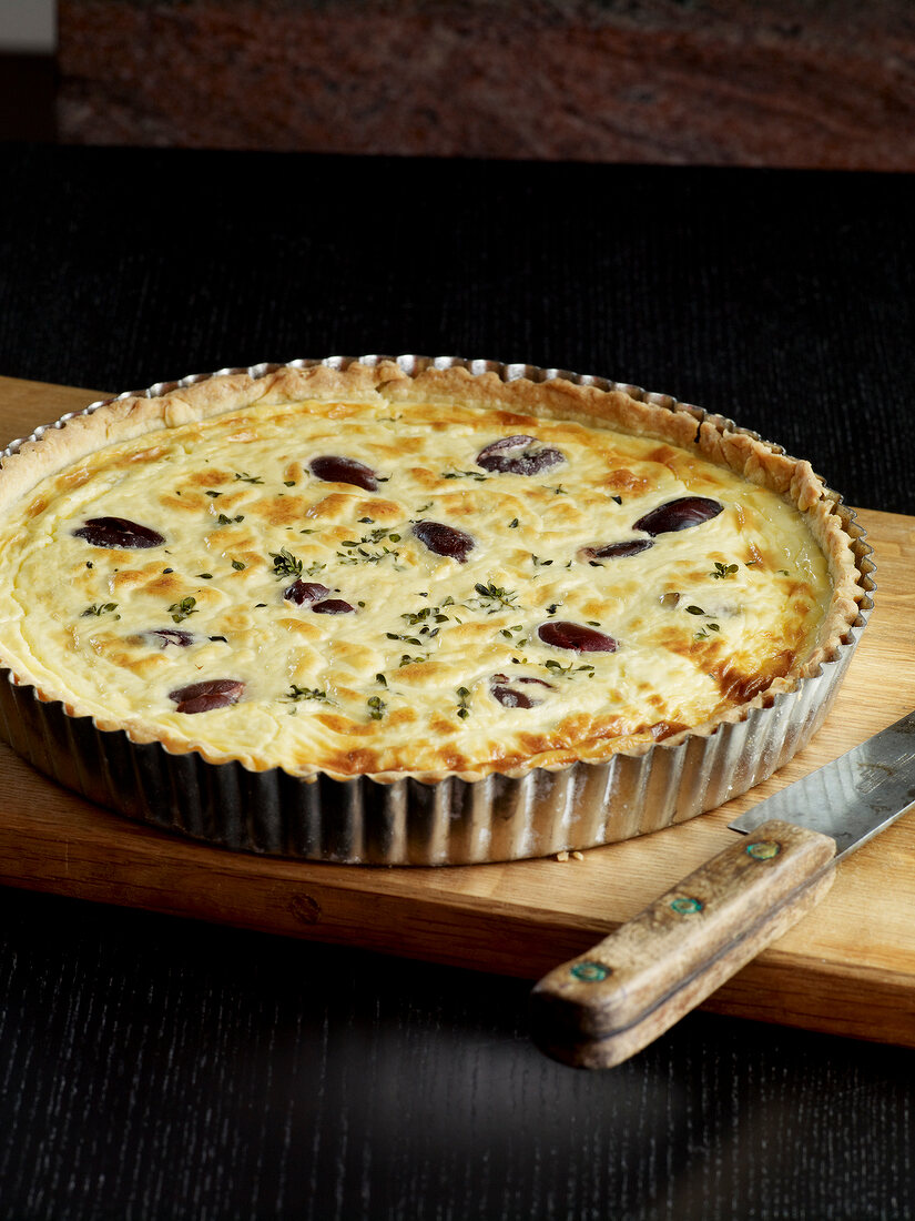 Goat cheese olive quiche in baking dish
