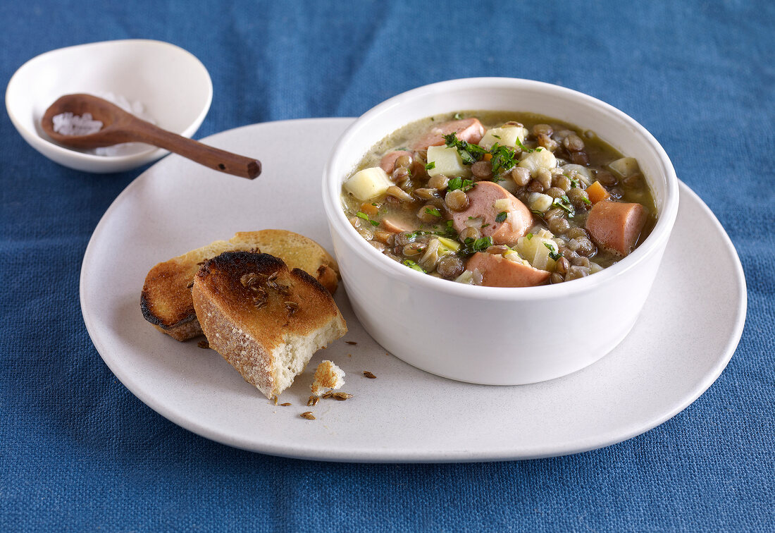 Lentil stew with wieners in bowl