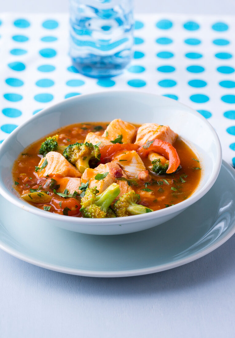 Fish stew with broccoli in bowl