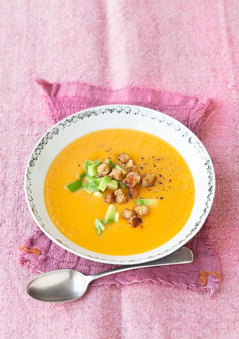 Sweet potato soup with avocado and croutons