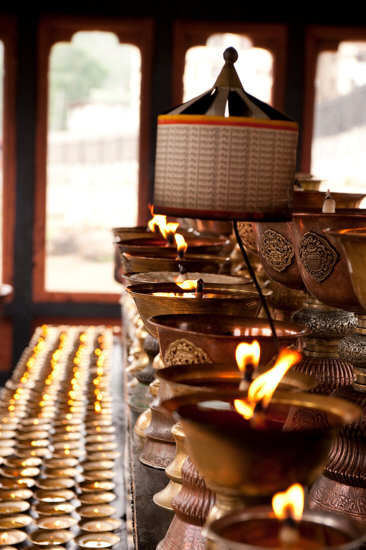 Burning butter lamps in Memorial Chorten in Thimphu, Bhutan