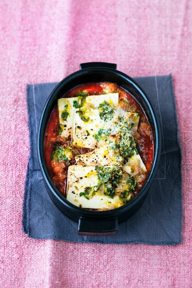 Tofu with herbs and lemon zest in tomato sauce