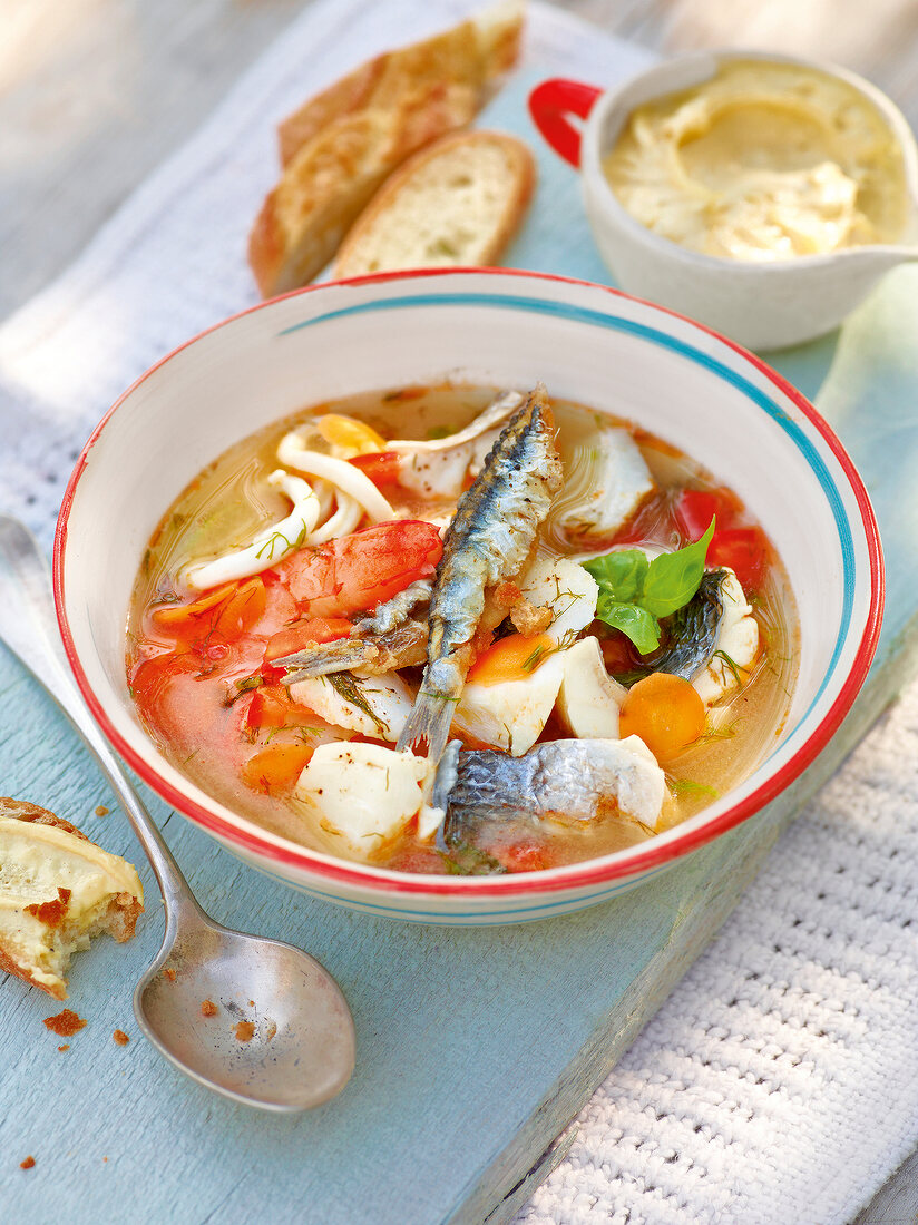 Fish soup with garlic mayonnaise in bowl