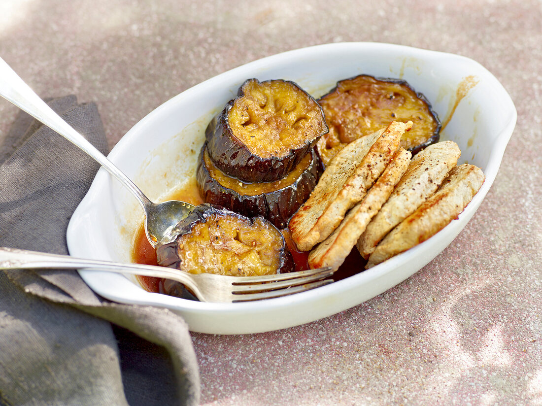 Candied eggplant with pork in serving dish