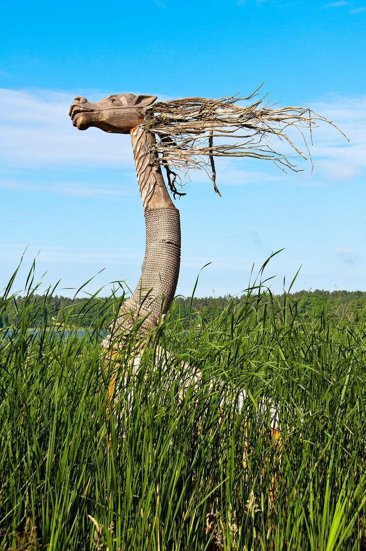 Animal shaped sculpture in grasses of Galindia Mazurski Eden, Warmia Masuria, Poland