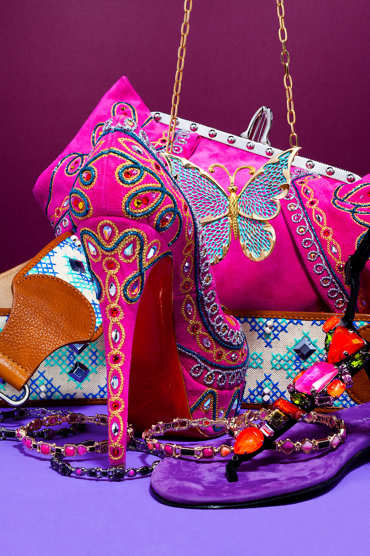 Compilation of colourful accessories, shoes and bag in pink