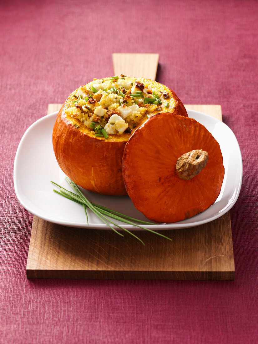 Pumpkin with millet filling on plate