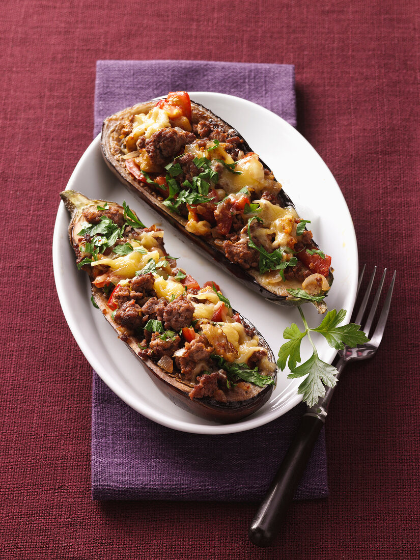 Stuffed eggplant on plate, overhead view