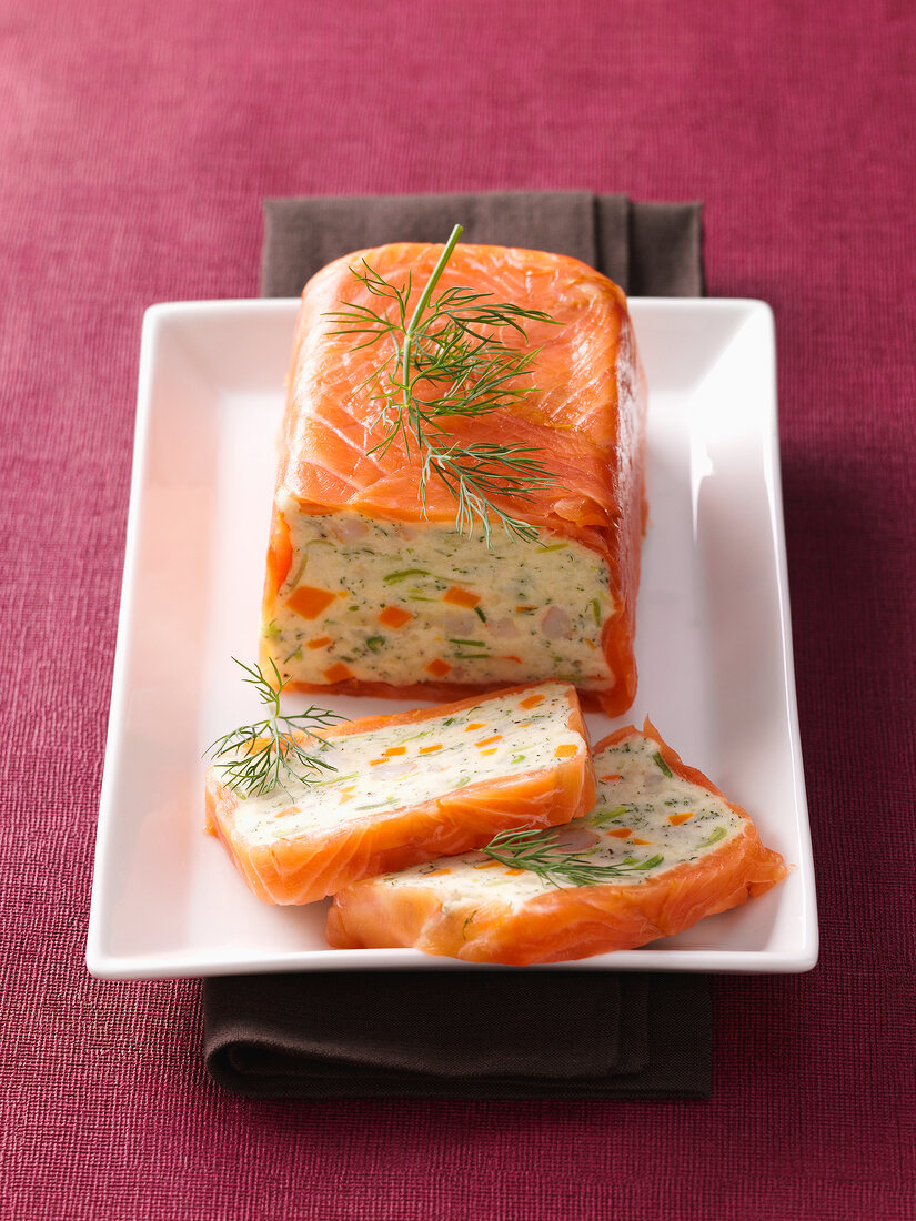Potato terrine wrapped in salmon in serving dish