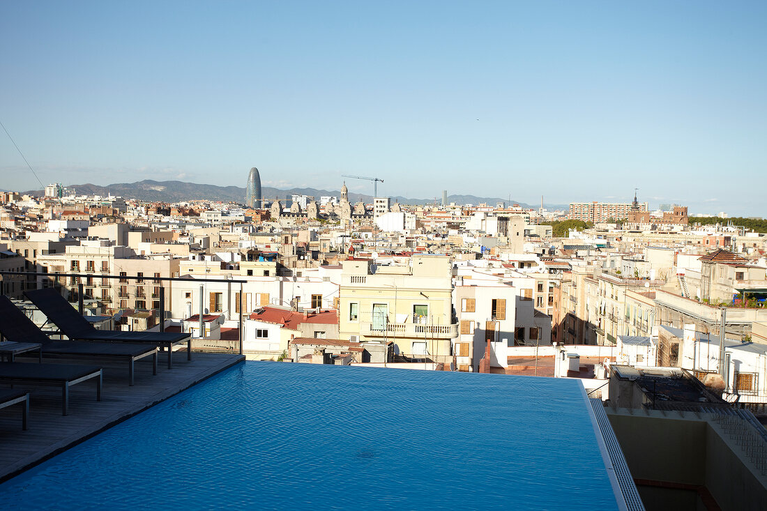 View of cityscape with Infinity Pool and Grand Hotel Central in Barcelona, Spain