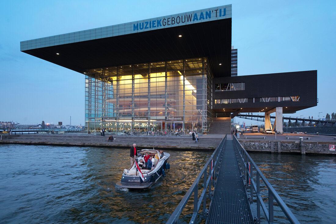 View of Muziekgebouw aan 't IJ on IJ river at dawn, Amsterdam, Netherlands