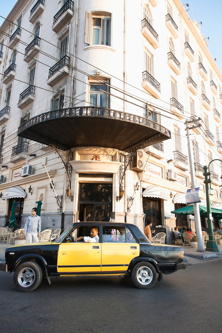 Car in front of entrance of Le Metropol Hotel in Alexandria, Egypt