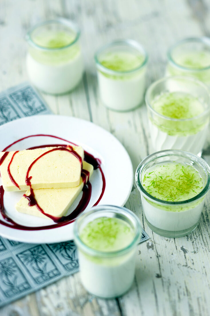 Yogurt parfait on plate beside elderflower cream in glasses