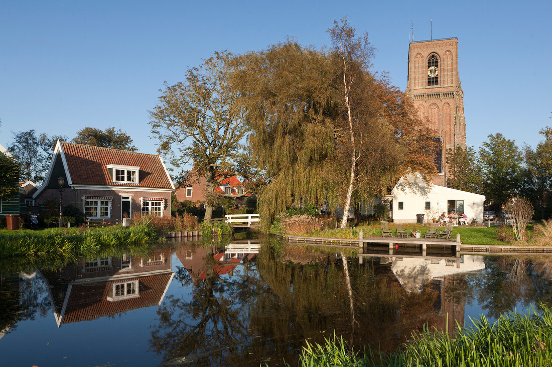 Picturesque of church and water in Ransdorp village, Noord, Amsterdam, Netherlands