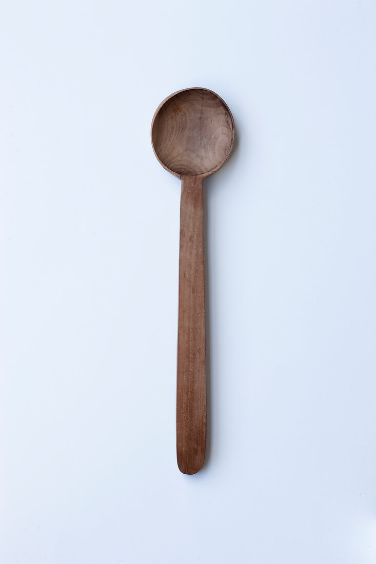 Large wooden spoon on white background