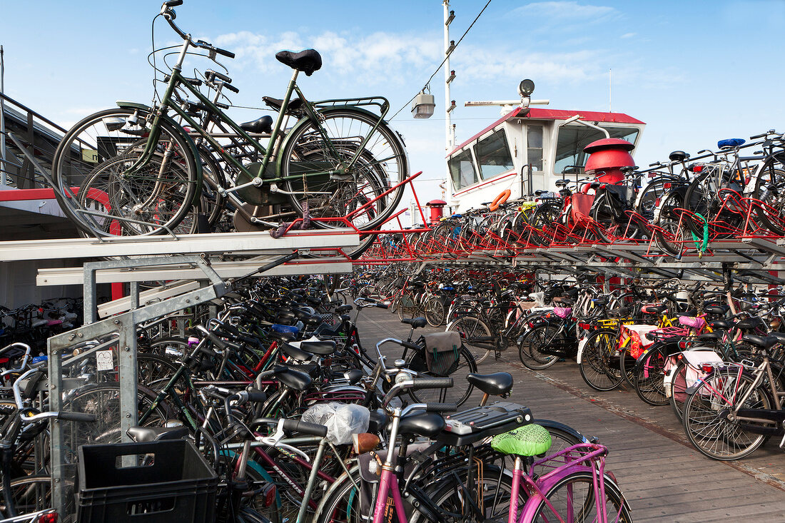 Bicycles parking at main station of old ferry, Amsterdam, Netherlands