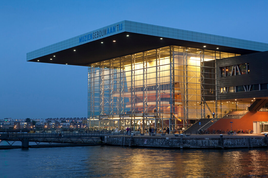 View of Muziekgebouw aan 't IJ on IJ river at dawn, Amsterdam, Netherlands