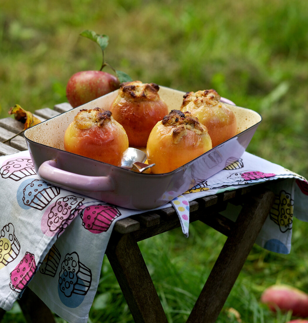 Baked apples with marzipan filling in baking tray