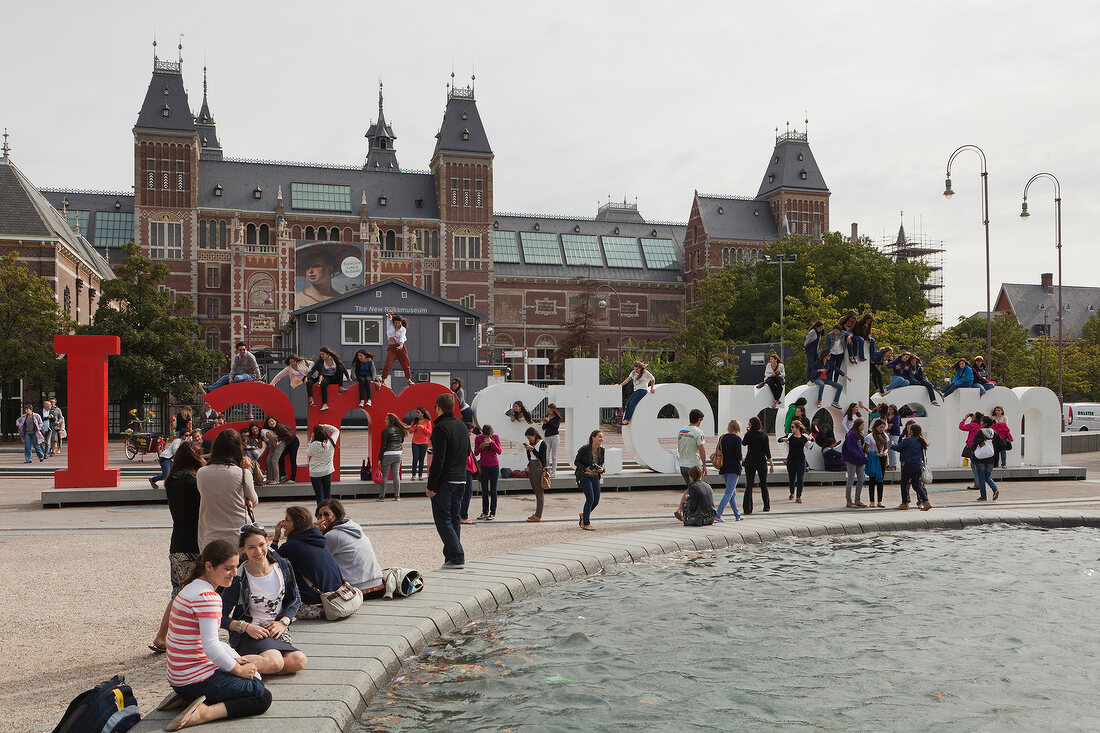 Tourists enjoying in Rijksmuseum at Museumplein, Amsterdam, Netherlands