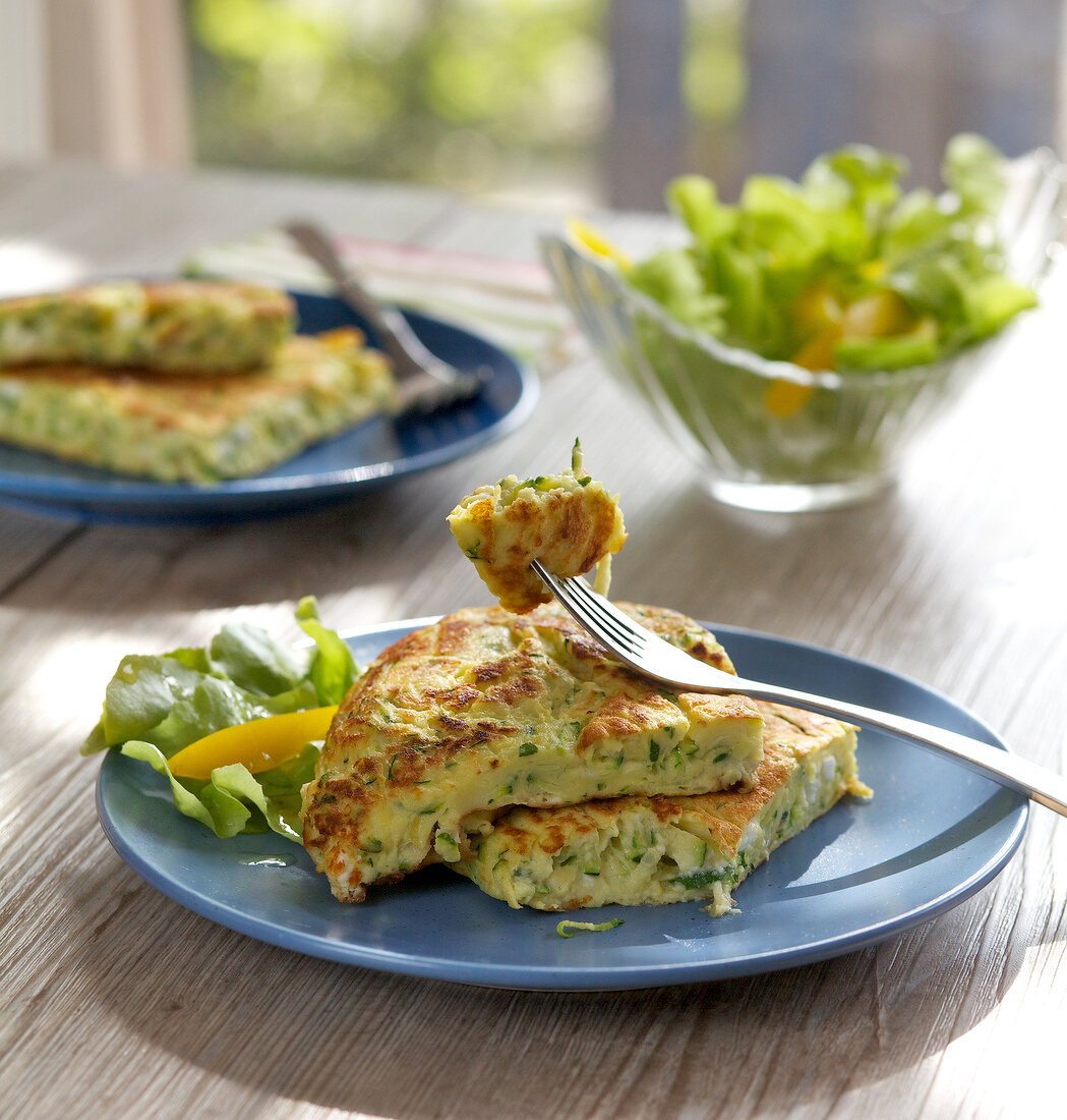 Zucchini pancakes with feta cheese on plate