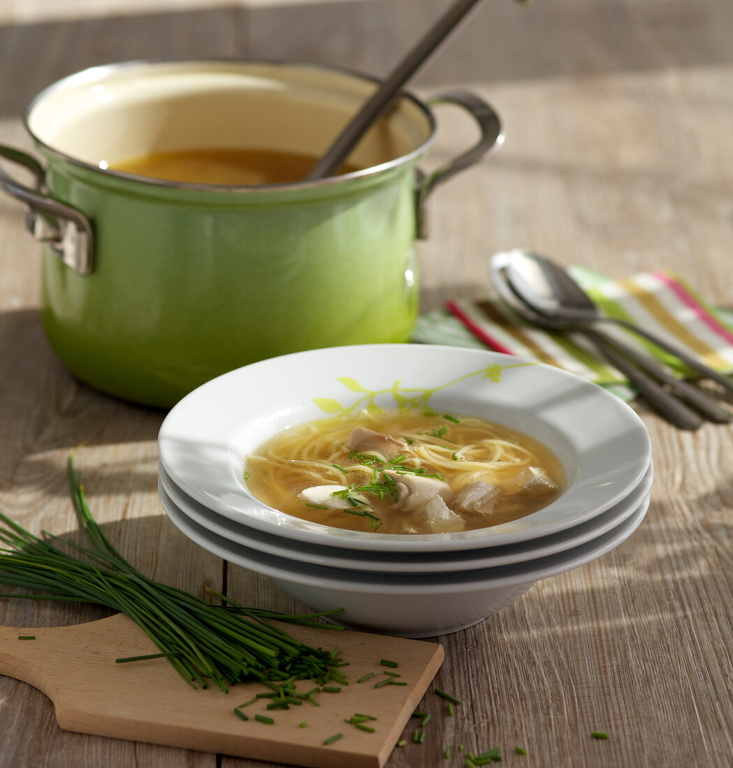 Chicken soup with noodles in bowl