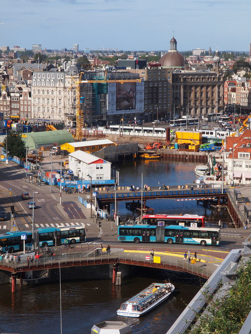View of city with Amsterdam Central, railway station, road, Amsterdam, Netherlands