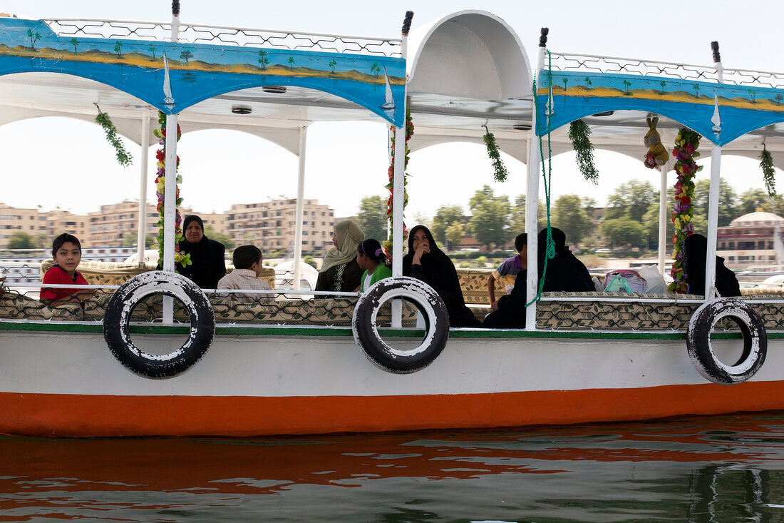 People travelling in ferry in Nile river, Aswan, Egypt