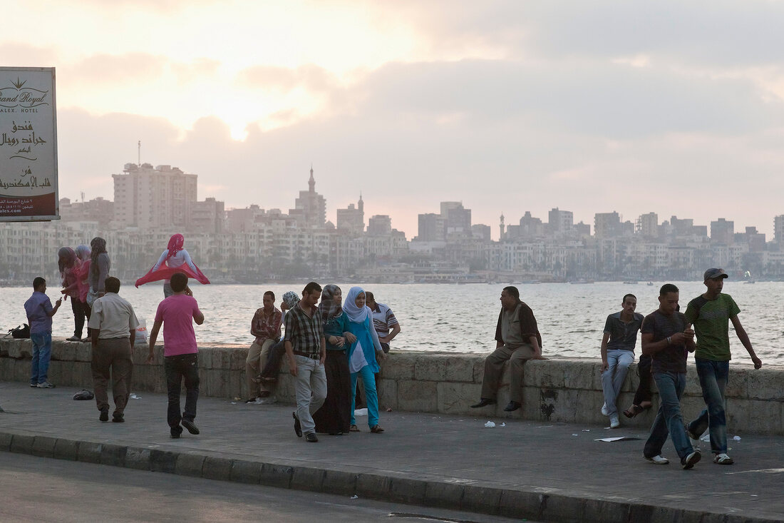 People at Corniche promenade in evening, Alexandria, Egypt