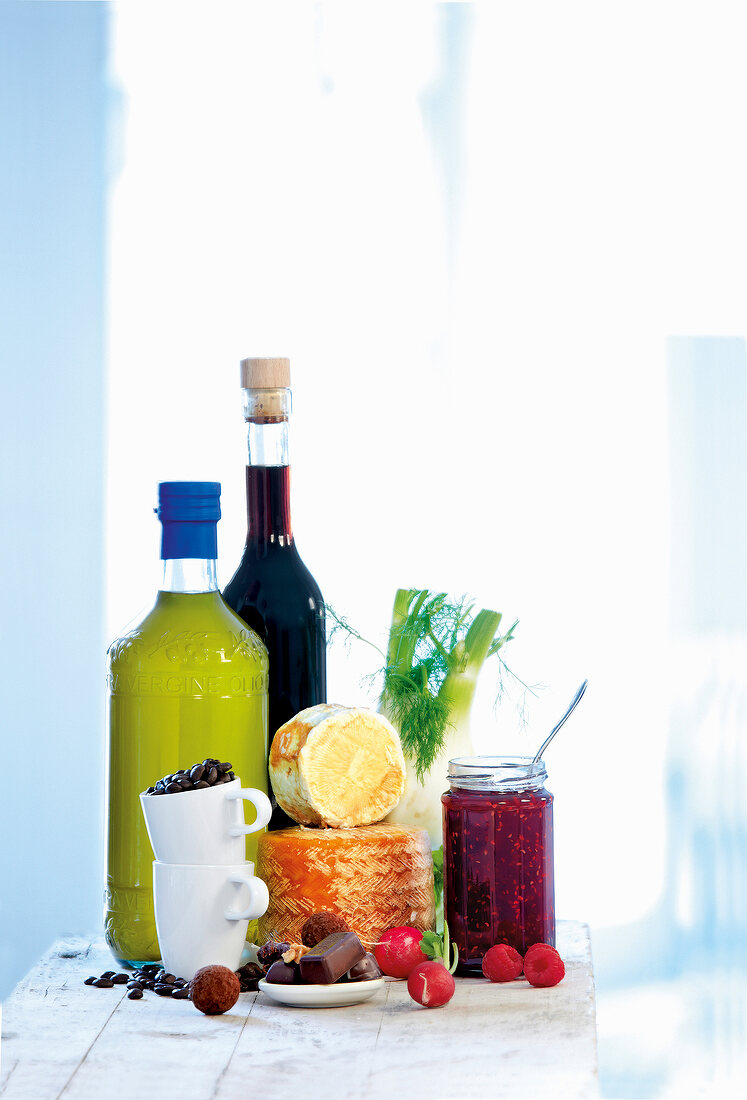 Various food and drinks in bottles, cups and jar