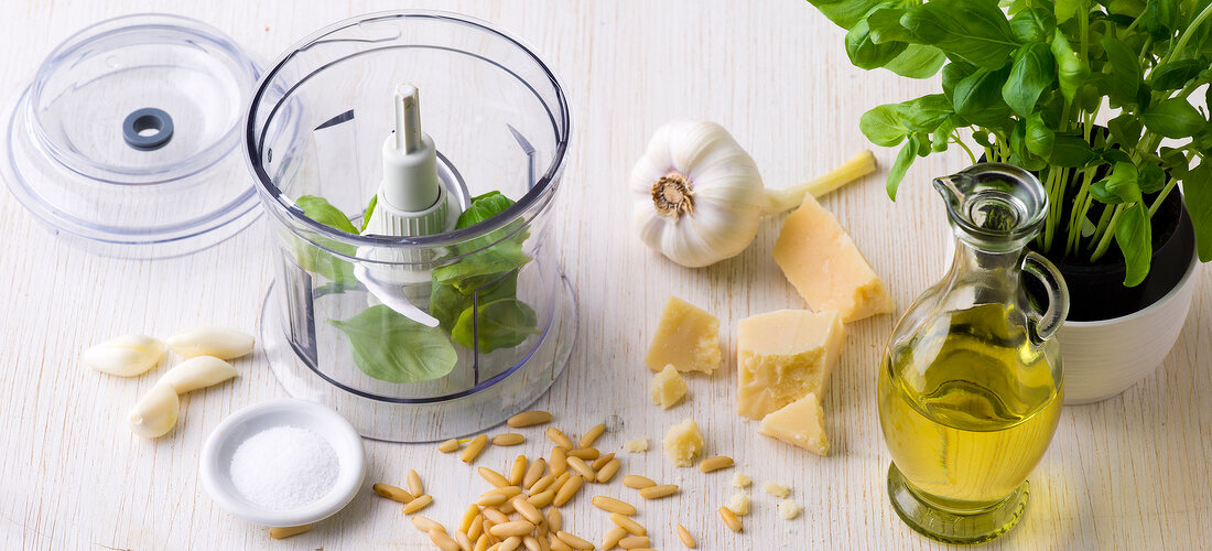 Different ingredients for basil pesto