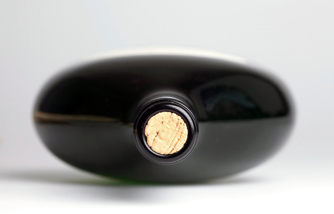 Close-up of mouth of wine bottle with cork in it