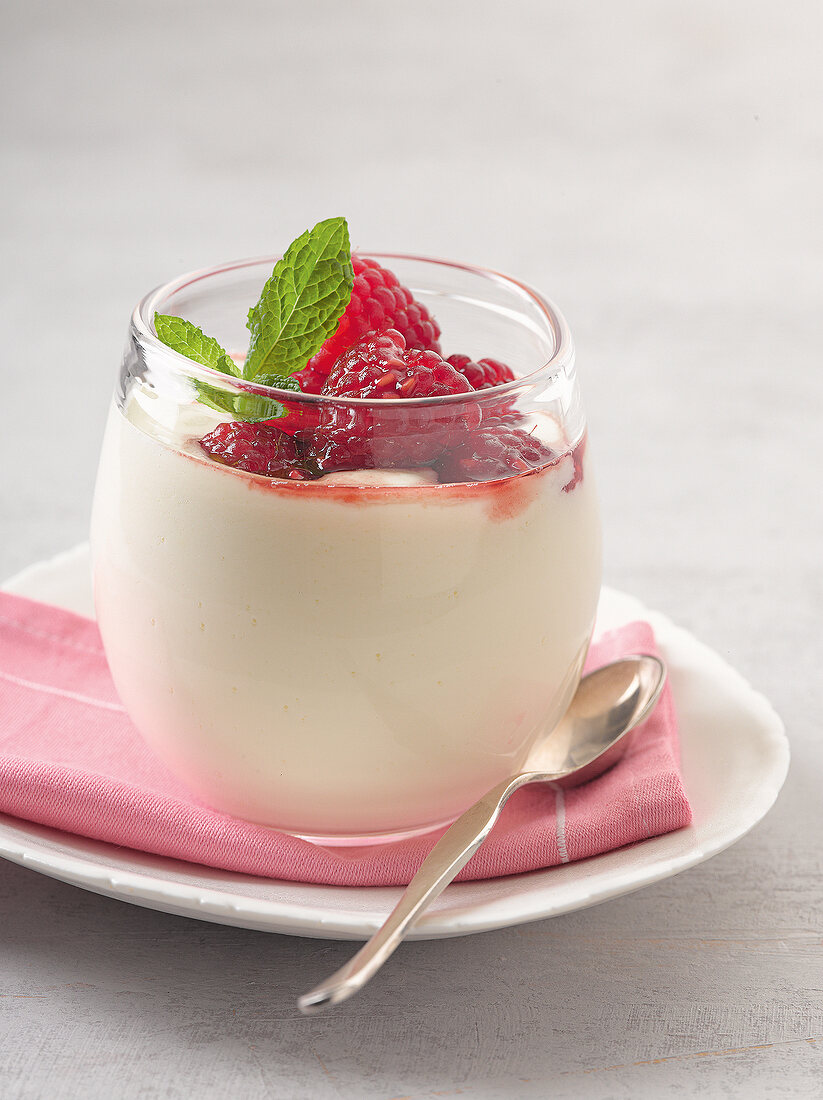 Close-up of raspberry curd in glass cup