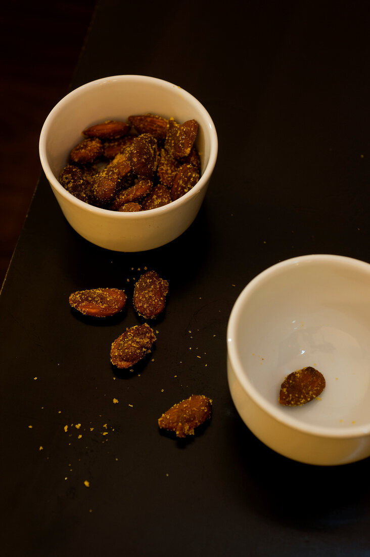 Curry with almonds in bowls