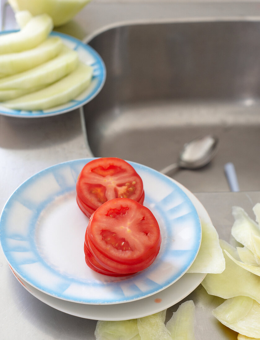 Tomato and melon slices on plate