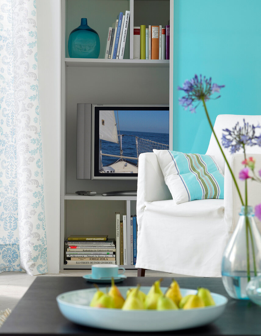 Living room in blue and turquoise with TV