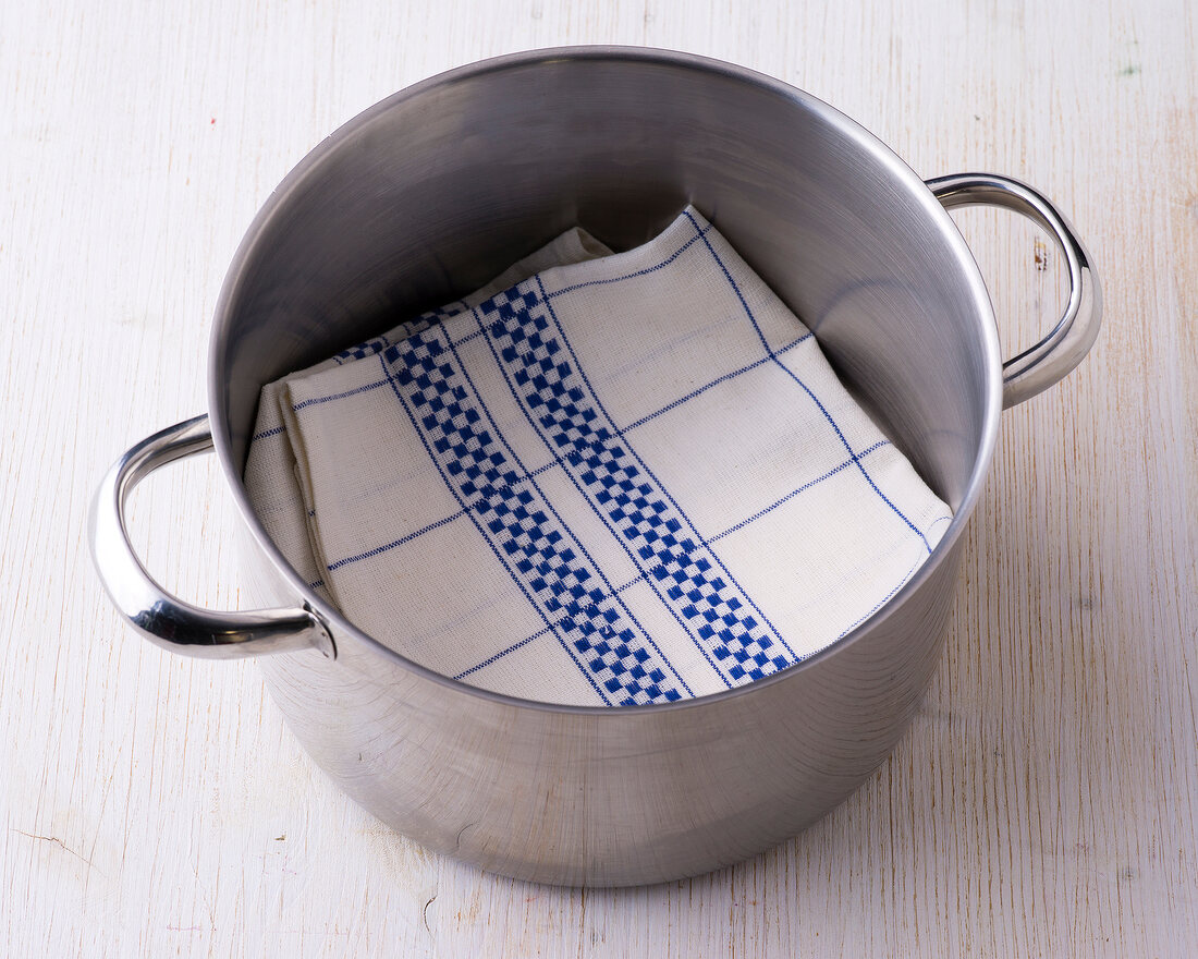 Folded kitchen towel in pot