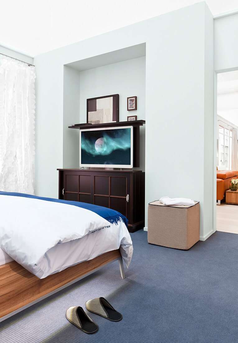 Bedroom with TV sideboard, TV and bed