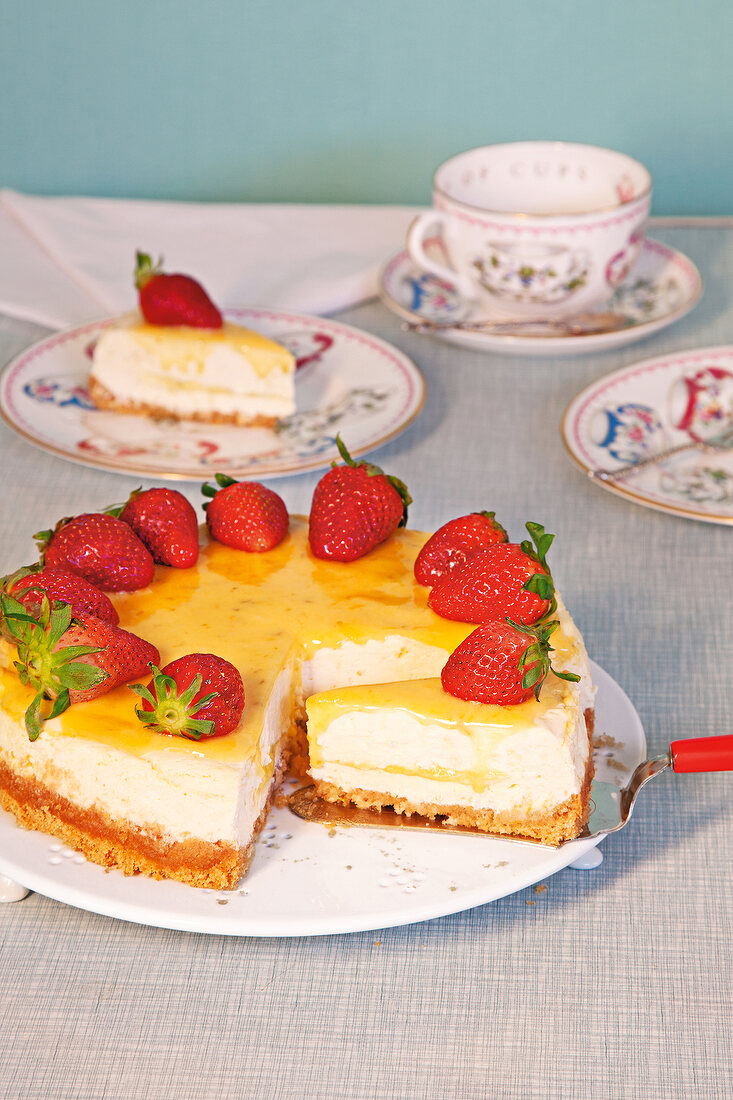 Lime cheesecake with strawberries on plate