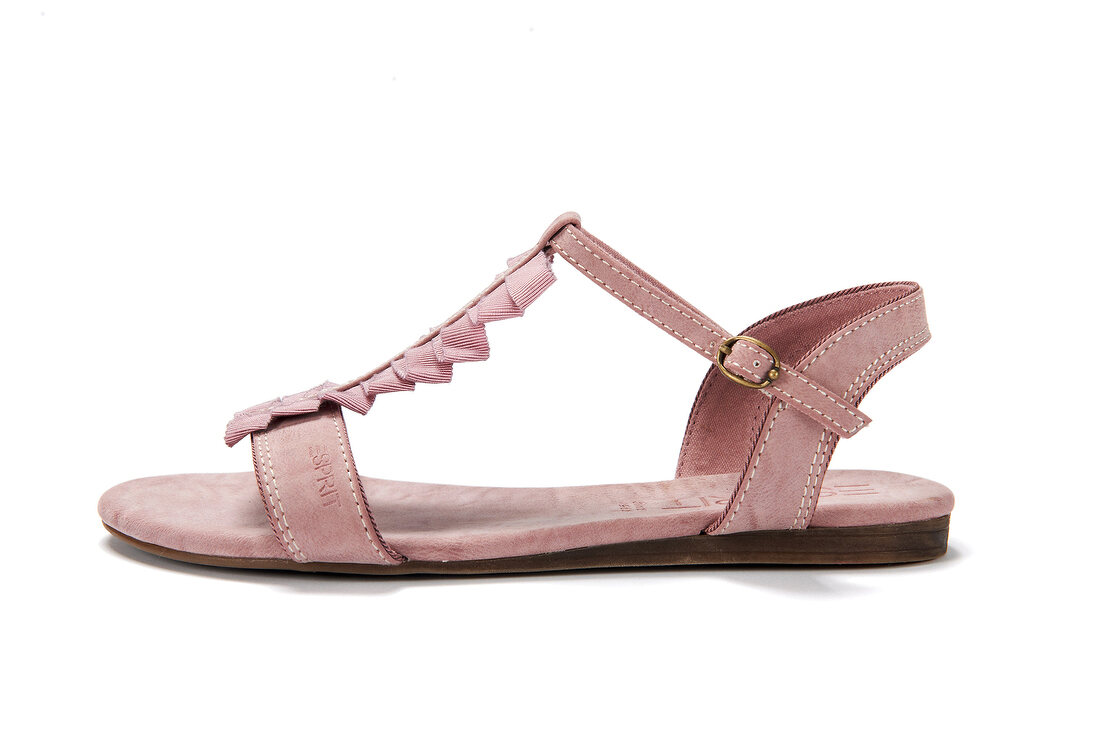 Close-up of pink leather sandal with strap on white background