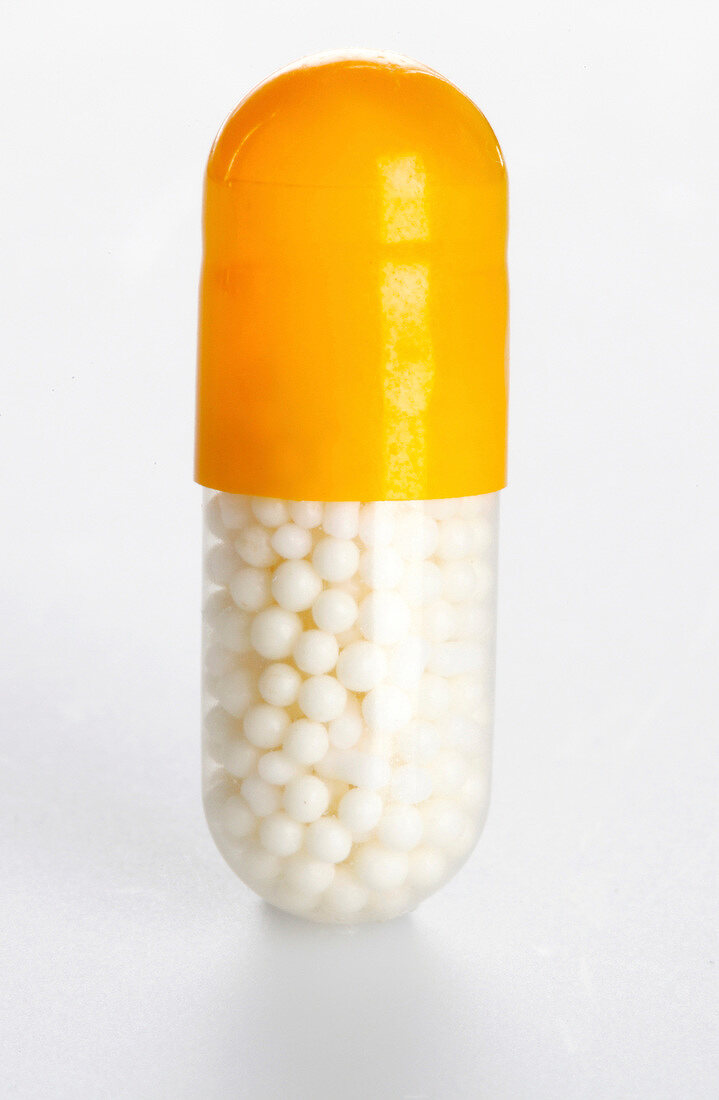 Close-up of capsule on white background