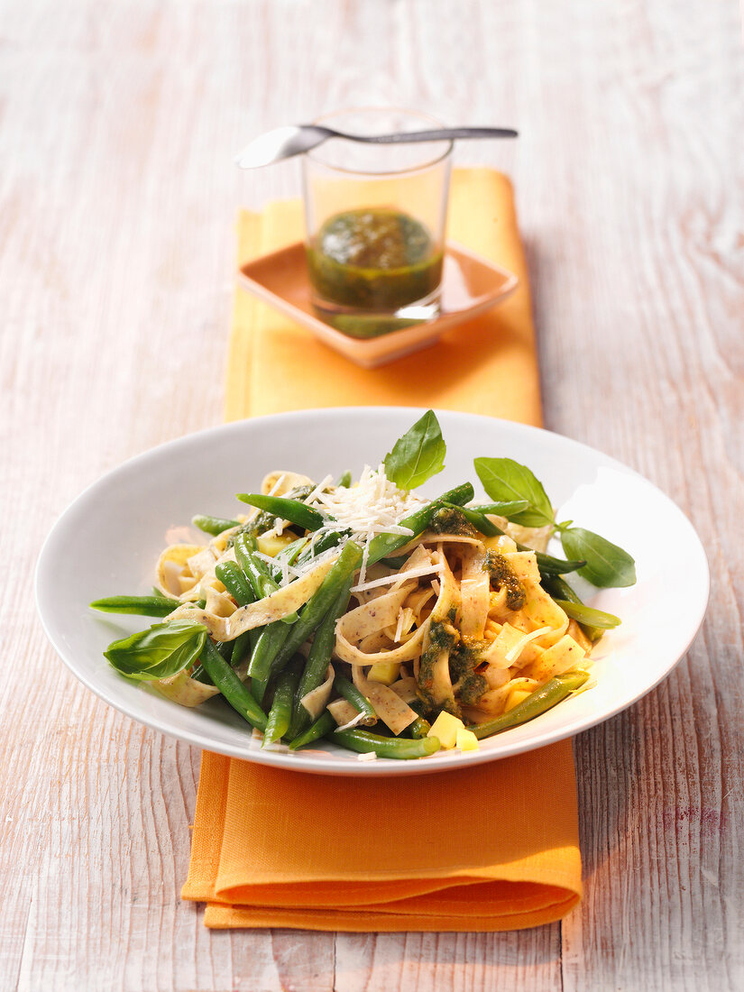 Tagliatelle pasta with beans on plate