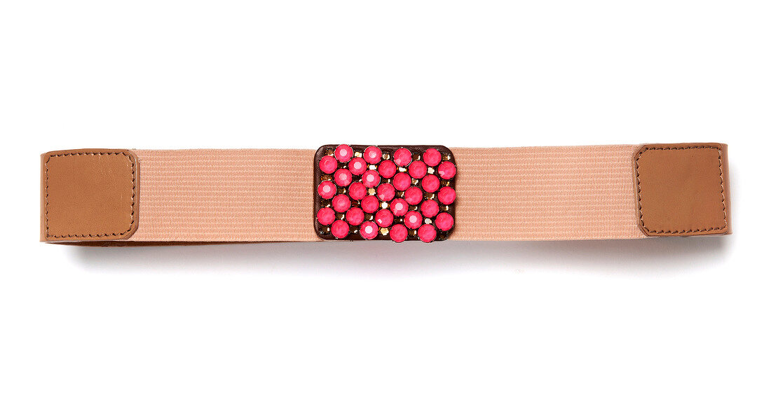 Belts with pink rhinestones on white background