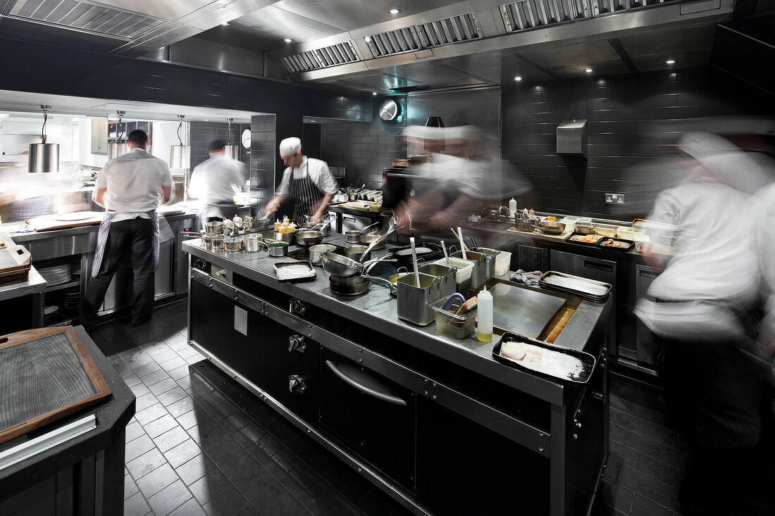 Cooks working in kitchen of Pollen Street Social restaurant in London, England