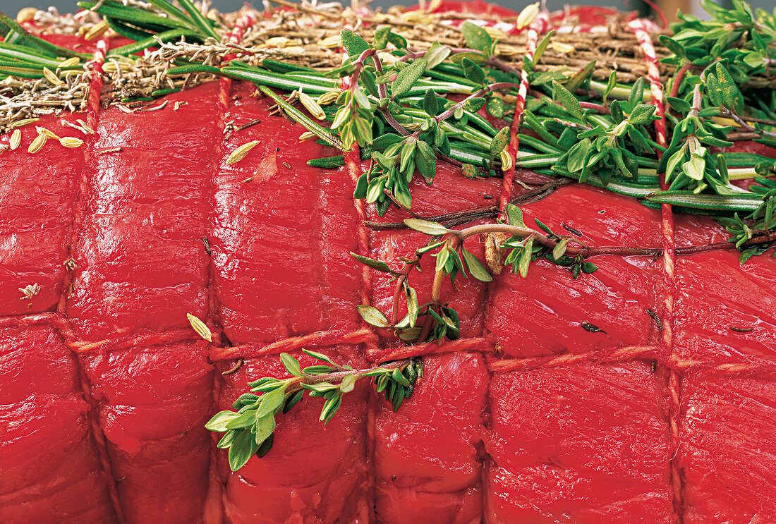 Close-up of roast beef with herbs